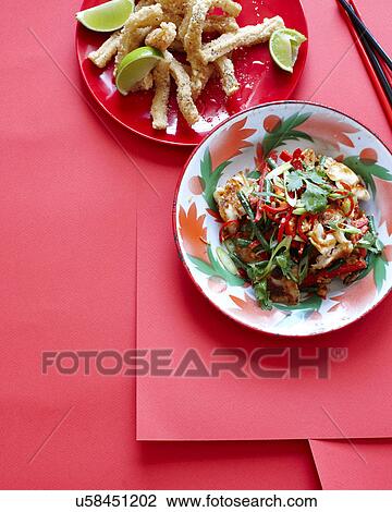Stock Image - Still life with bowl of soursop and lime. Fotosearch