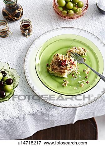 Still life with Egyptian pudding with pomegranate seeds View Large Photo Image Stock Photo - Still life with Egyptian pudding with pomegranate seeds. Fotosearch