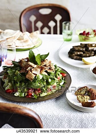 "Still life with fattoush, vine leaves and flat breads" View Large Photo Image Stock Image - "Still life with fattoush, vine leaves and flat breads". Fotosearch