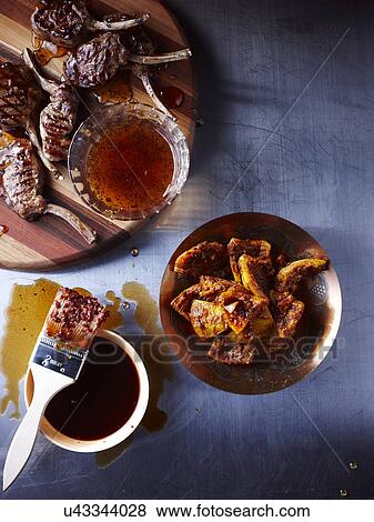 Still life with lamb chops glazed with mint jelly View Large Photo Image Stock Photo - Still life with lamb chops glazed with mint jelly. Fotosearch