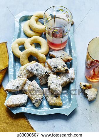 Still life with plate of Italian zaletti and bussolai View Large Photo Image Stock Photo - Still life with plate of Italian zaletti and bussolai. Fotosearch