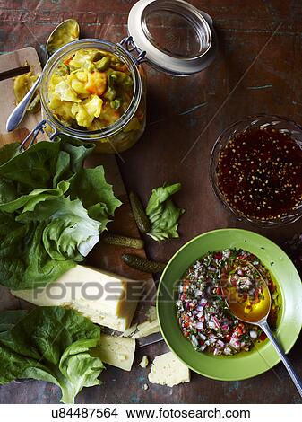 Picture - Still life with three home made piccalillis with cheese and lettuce. Fotosearch