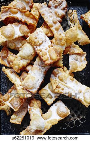 Still life with tray of Italian crostoli View Large Photo Image Stock Photo - Still life with tray of Italian crostoli. Fotosearch