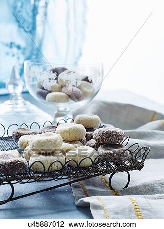 Stock Image - Still life with tray of Italian fave dei morti cakes. Fotosearch