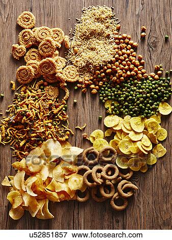 Stock Photo - Still life with variety of Indian curried snacks. Fotosearch