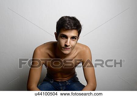Picture - Studio portrait of confident bare chested young man. Fotosearch