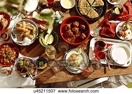 "Table selection of meatballs, spanish omelette, salted cod, bread and fruit punch" View Large Photo Image Stock Photo - "Table selection of meatballs, spanish omelette, salted cod, bread and fruit punch". Fotosearch