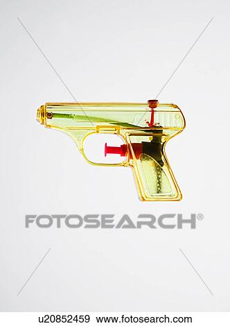 Stock Photo - Transparent water pistol on white background. Fotosearch