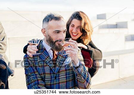 Picture - Two friends fooling around at party. Fotosearch
