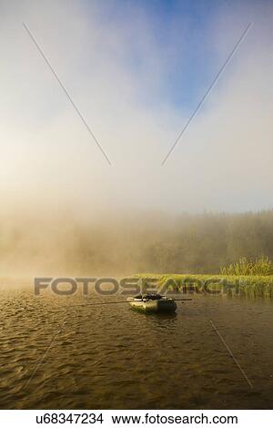 "View of dinghy on misty river, Sarsy Village, Sverdlovsk Oblast, Russia" View Large Photo Image Picture - "View of dinghy on misty river, Sarsy Village, Sverdlovsk Oblast, Russia". Fotosearch