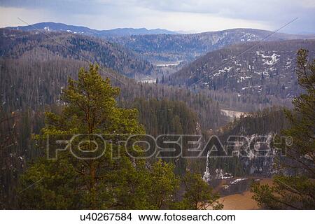 Picture - "View of forest and distant mountains, Sarsy Village, Sverdlovsk Oblast, Russia". Fotosearch