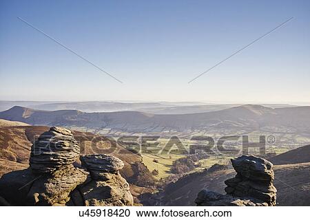 Stock Image - "View of rock formations and valley, Hope Valley, Peak District, UK". Fotosearch