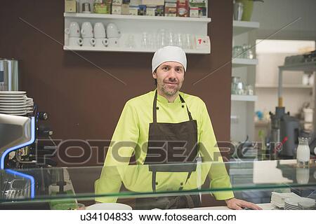 Waiter working at cafe View Large Photo Image Stock Image - Waiter working at cafe. Fotosearch