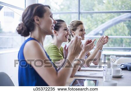 Women applauding at end of presentation View Large Photo Image Stock Photography - Women applauding at end of presentation. Fotosearch