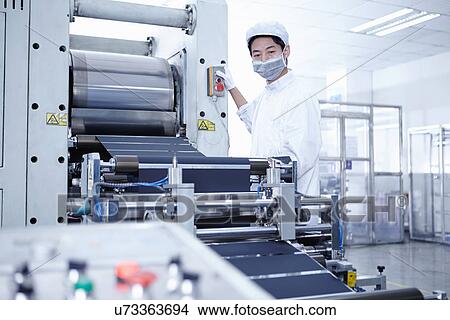 Picture - "Worker at e-cigarettes battery factory, Guangdong, China". Fotosearch