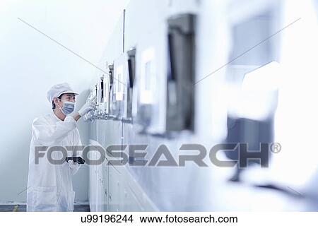 Picture - "Worker at e-cigarettes battery factory, Guangdong, China". Fotosearch