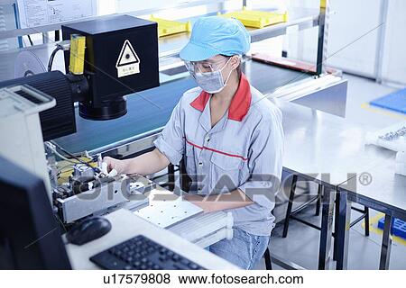 "Worker at e-cigarettes battery factory, Guangdong, China" View Large Photo Image Stock Photo - "Worker at e-cigarettes battery factory, Guangdong, China". Fotosearch