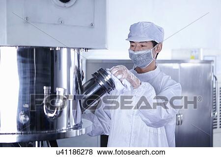 "Worker at e-cigarettes battery factory, Guangdong, China" View Large Photo Image Stock Photo - "Worker at e-cigarettes battery factory, Guangdong, China". Fotosearch