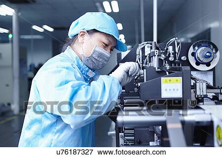 "Worker at e-cigarettes battery factory, Guangdong, China" View Large Photo Image Stock Photo - "Worker at e-cigarettes battery factory, Guangdong, China". Fotosearch