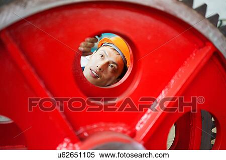 "Worker using equipment in crane manufacturing facility, China" View Large Photo Image Stock Photography - "Worker using equipment in crane manufacturing facility, China". Fotosearch