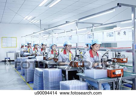 Picture - "Workers at e-cigarettes battery factory, Guangdong, China". Fotosearch