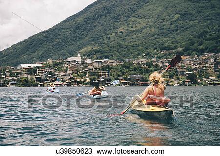 "Young adult friends kayaking on Lake Atitlan, Guatemala" View Large Photo Image Stock Image - "Young adult friends kayaking on Lake Atitlan, Guatemala". Fotosearch