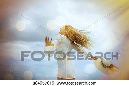 Stock Photo - "Young blond woman running on Miami Beach, Florida, USA". Fotosearch