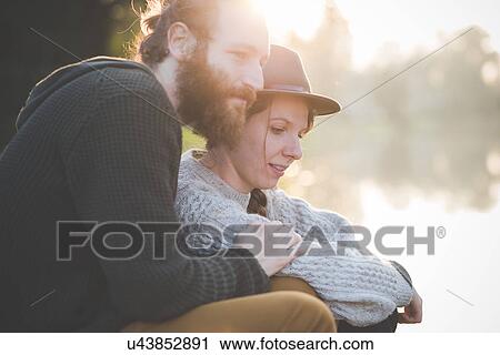 Young couple in sunlight View Large Photo Image Stock Image - Young couple in sunlight. Fotosearch
