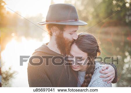 Young couple in sunlight View Large Photo Image Stock Image - Young couple in sunlight. Fotosearch