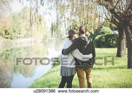"Young couple on riverbank, Dolo, Venice, Italy" View Large Photo Image Stock Photograph - "Young couple on riverbank, Dolo, Venice, Italy". Fotosearch