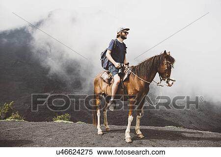 "Young man horse trekking at Pacaya volcano, Antigua, Guatemala" View Large Photo Image Stock Photography - "Young man horse trekking at Pacaya volcano, Antigua, Guatemala". Fotosearch