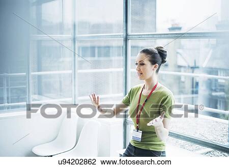 Young woman conducting training presentation View Large Photo Image Stock Image - Young woman conducting training presentation. Fotosearch