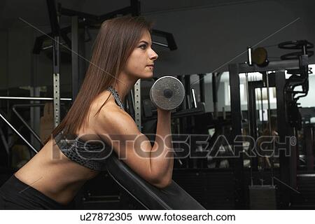 "Young woman, lifting weights" View Large Photo Image Stock Photography - "Young woman, lifting weights". Fotosearch