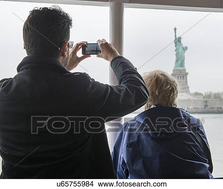 Picture - "Statue of Liberty, Liberty Island, New York Harbor, Manhattan, New York City, New York State, USA". Fotosearch