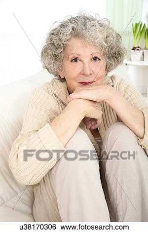 Woman resting with her chin on hands View Large Photo Image Stock Photograph - Woman resting with her chin on hands. Fotosearch