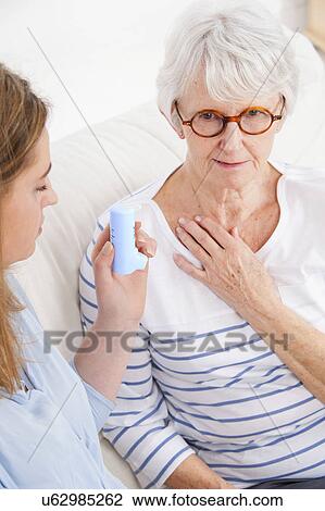 Woman touching throat View Large Photo Image Stock Image - Woman touching throat. Fotosearch