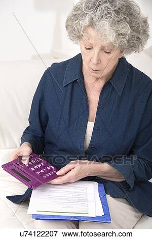 Woman using calculator View Large Photo Image Stock Photo - Woman using calculator. Fotosearch