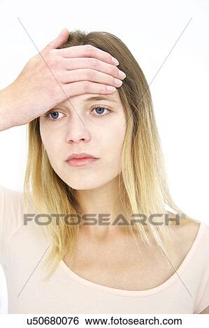 Stock Photograph - Woman with hand on forehead. Fotosearch