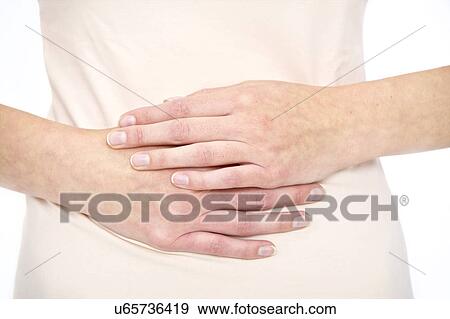 Woman with hands on stomach View Large Photo Image Stock Photo - Woman with hands on stomach. Fotosearch