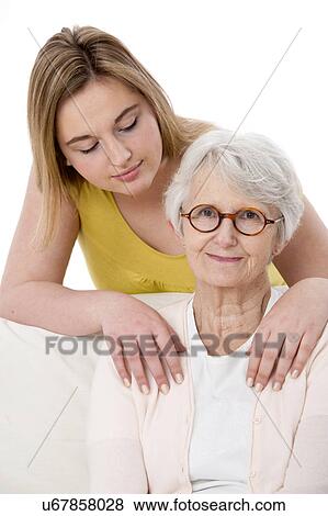 Stock Photo - Woman with her hands on shoulders of woma. Fotosearch
