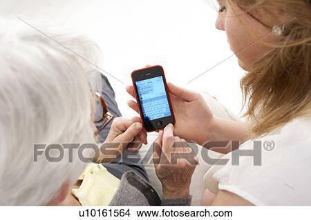 Picture - Women with smartphone. Fotosearch