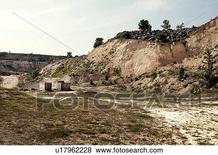 Abandoned quarry with dirt track and concrete blocks View Large Photo Image Stock Photo - Abandoned quarry with dirt track and concrete blocks. Fotosearch
