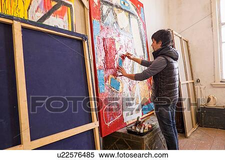Artist drawing on abstract painting in studio View Large Photo Image Stock Photography - Artist drawing on abstract painting in studio. Fotosearch