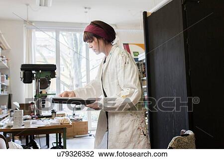 Artist working in studio View Large Photo Image Stock Image - Artist working in studio. Fotosearch