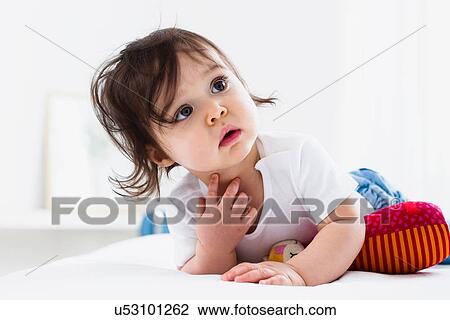 Baby boy playing on floor View Large Photo Image Stock Image - Baby boy playing on floor. Fotosearch