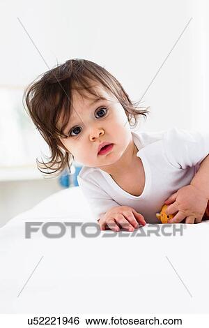 Baby boy playing on floor View Large Photo Image Stock Photograph - Baby boy playing on floor. Fotosearch