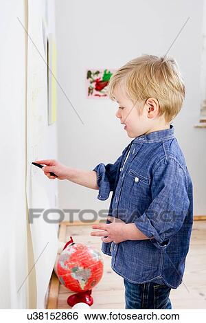Boy drawing on wall View Large Photo Image Stock Photograph - Boy drawing on wall. Fotosearch