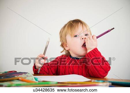 Boy holding colouring pencils View Large Photo Image Stock Photography - Boy holding colouring pencils. Fotosearch