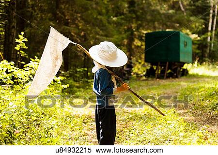 "Boy in woods with butterfly net, Sarsy village, Sverdlovsk Region, Russia" View Large Photo Image Stock Photography - "Boy in woods with butterfly net, Sarsy village, Sverdlovsk Region, Russia". Fotosearch