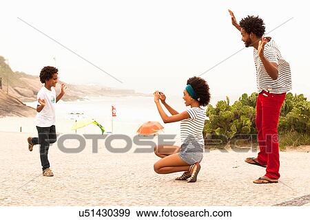 "Boy posing for family photograph on Ipanema Beach, Rio De Janeiro, Brazil" View Large Photo Image Stock Photo - "Boy posing for family photograph on Ipanema Beach, Rio De Janeiro, Brazil". Fotosearch